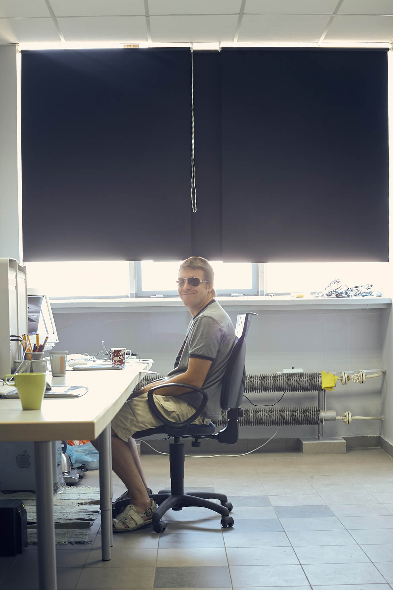 Another view of Krzysztof Gadomski working at his desk in the first House of Retouching studio in 2008.